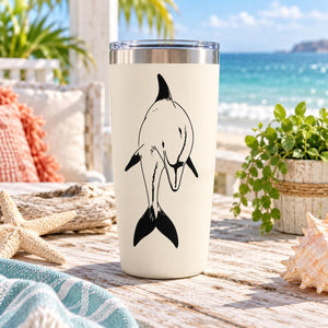 White tumbler with black dolphin decal on front