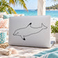 Dolphin decal in black line art on a light-colored laptop lid