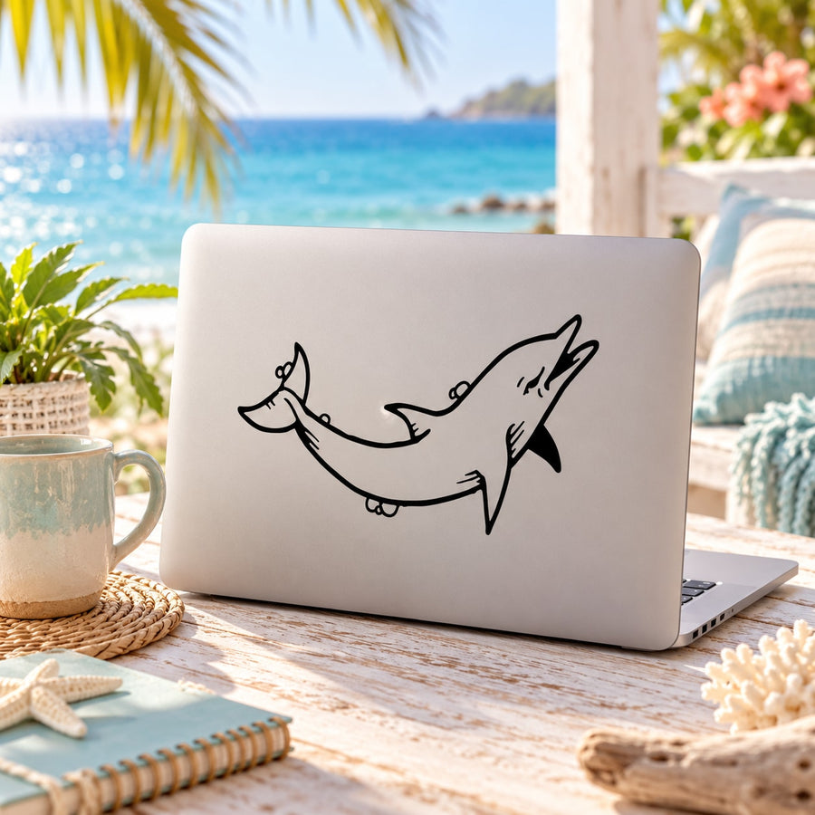 Dolphin decal in black line art on light laptop cover