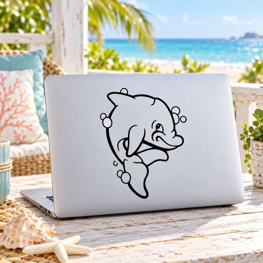 Dolphin decal with black smiling bubble outline on a laptop lid