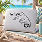 Dolphin and seaweed line-art decal on white surface