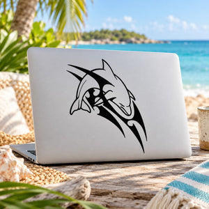 Black stylized dolphin razor decal on laptop lid.