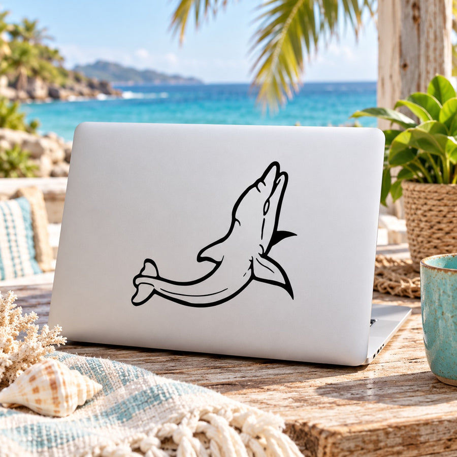 Laughing dolphin decal in black line art on a white laptop lid