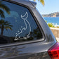 White dolphin decal with smiling face and bubble accents on car window