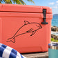 Dolphin swimming line-art decal for cooler, black outline on orange surface