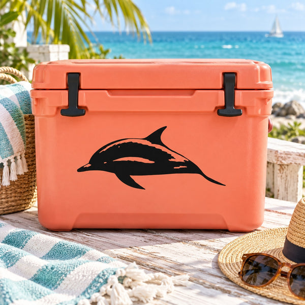 Black spinner dolphin decal on orange hard cooler surface