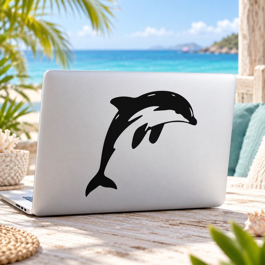 Leaping dolphin vinyl decal, bold black silhouette on light surface
