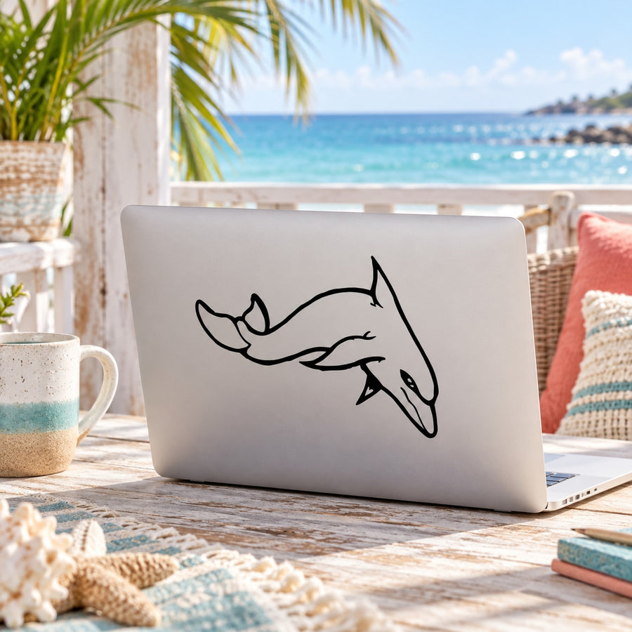 Black line-art dolphin decal sticker on a light laptop
