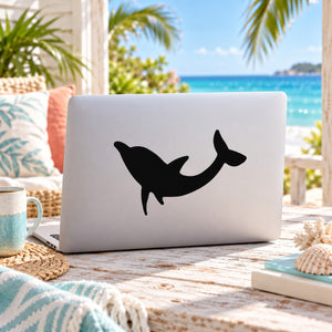 Black up-turned dolphin vinyl decal on white laptop lid