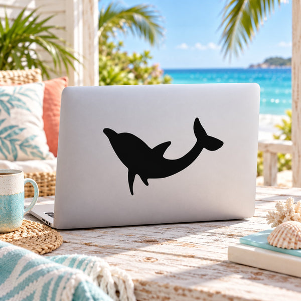 Black up-turned dolphin vinyl decal on white laptop lid