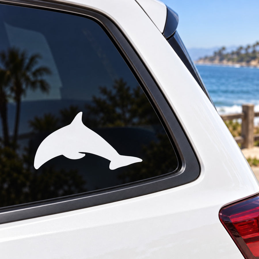 White dolphin decal on car window