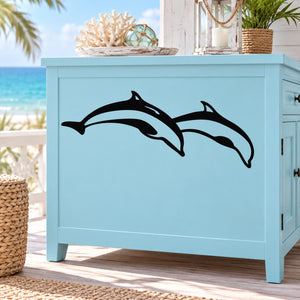 Two dolphins diving decal with two black dolphin silhouettes