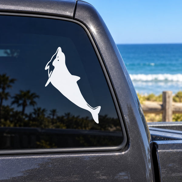 White dolphin swimming up vinyl decal on car window glass