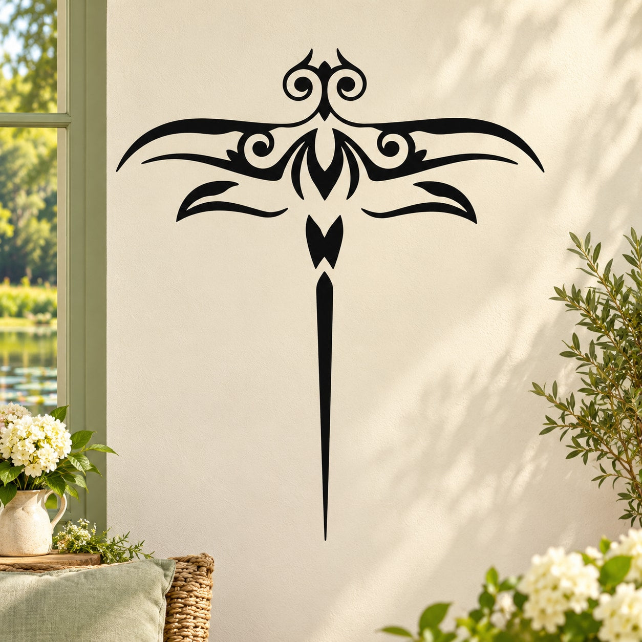 Black dragonfly wall decal with ornate wings and long pointed tail