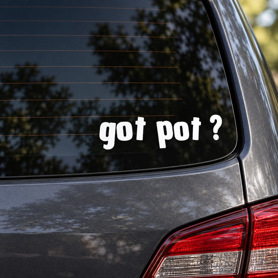 Car window vinyl decal with “got pot ?” text in white on dark background