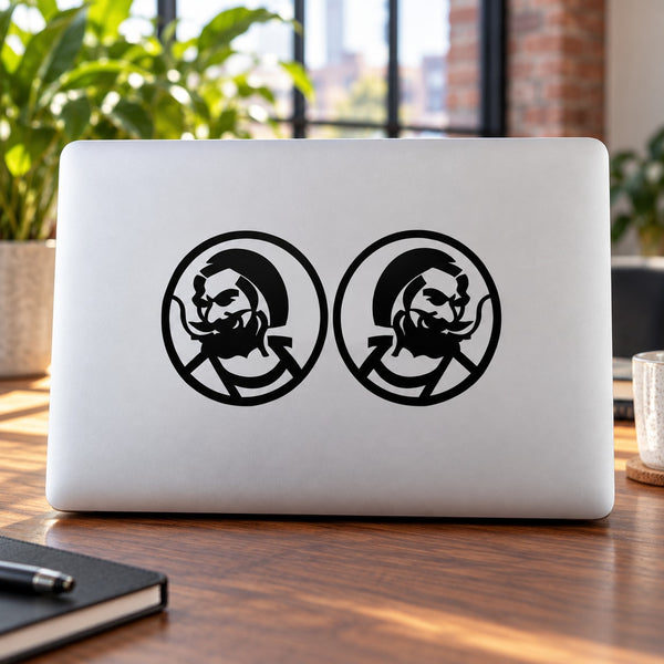 Black circular character decals on white laptop lid
