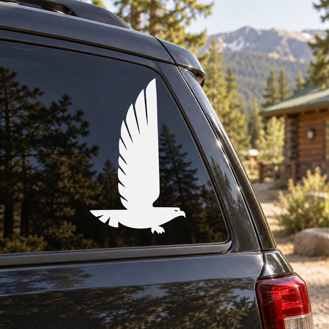 White flying eagle decal on a car side window panel