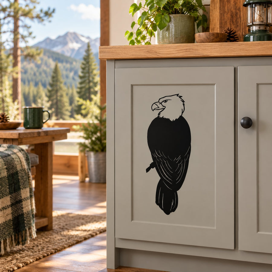 Eagle perched decal with black bird silhouette design on a light panel