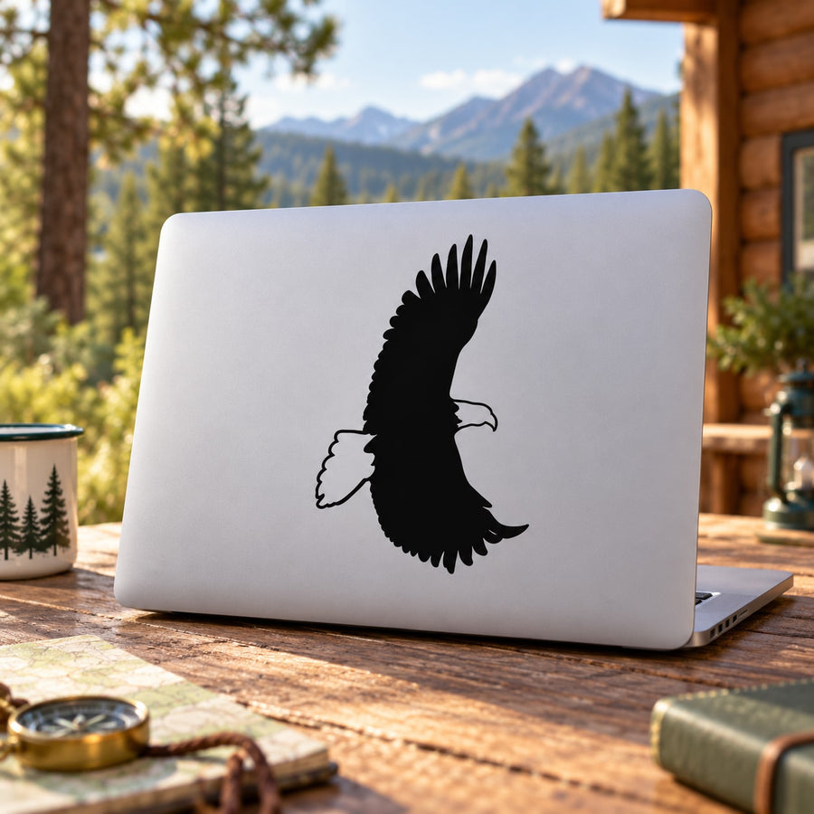 Black eagle flapping vinyl decal on white surface