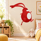 Red striding Easter bunny sticker with curved ears and white belly patch