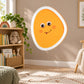 Cartoon egg yolk face sticker with orange oval and smiling eyes