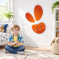 Abstract Easter bunny sticker, orange face with gray outline and whisker details