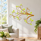Swirling tree branch wall decal with green leaves and brown scrollwork
