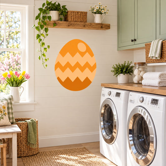 Orange Easter egg sticker with white chevron zigzag pattern