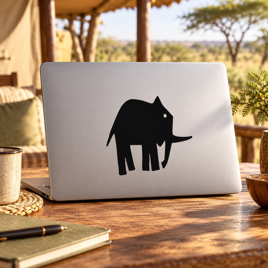 Minimal black elephant decal silhouette on a laptop lid