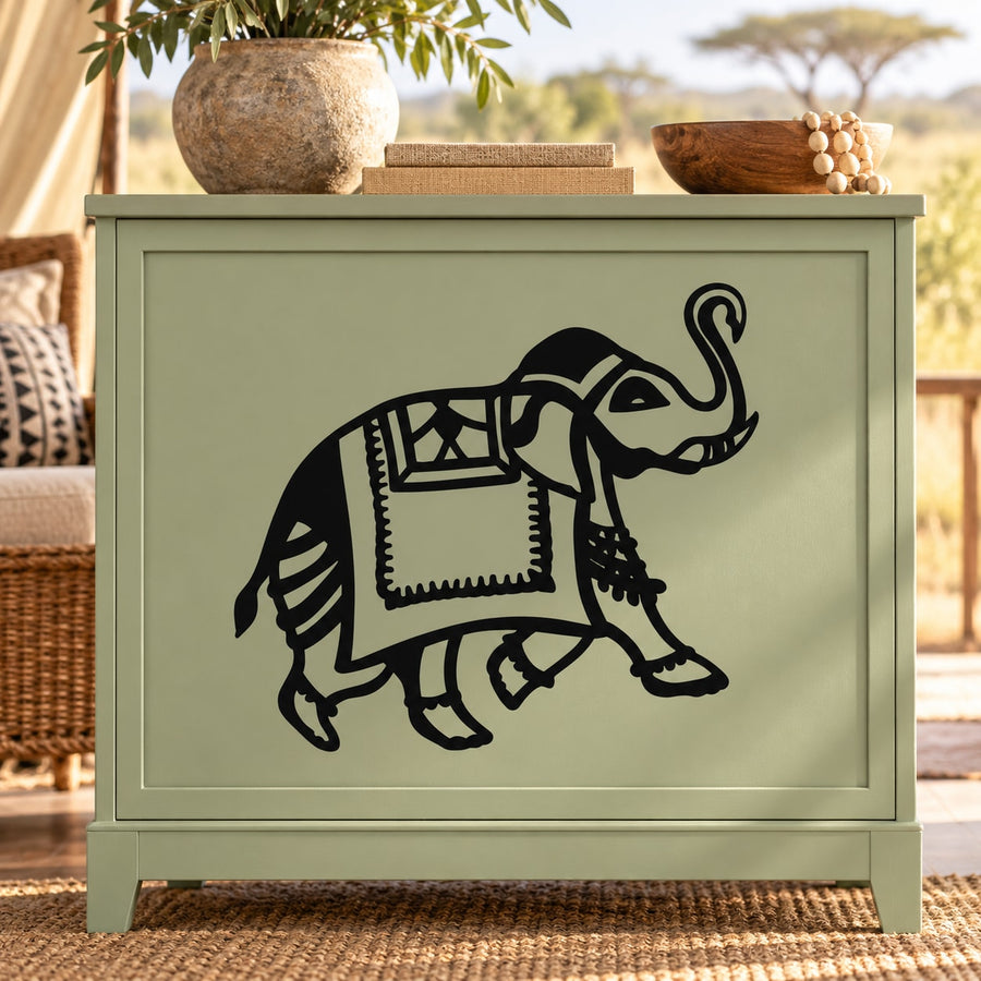 Black elephant decal holding a book, line-art style