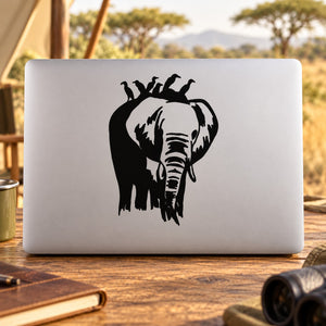 White laptop decal featuring black elephant silhouette with birds perched on head