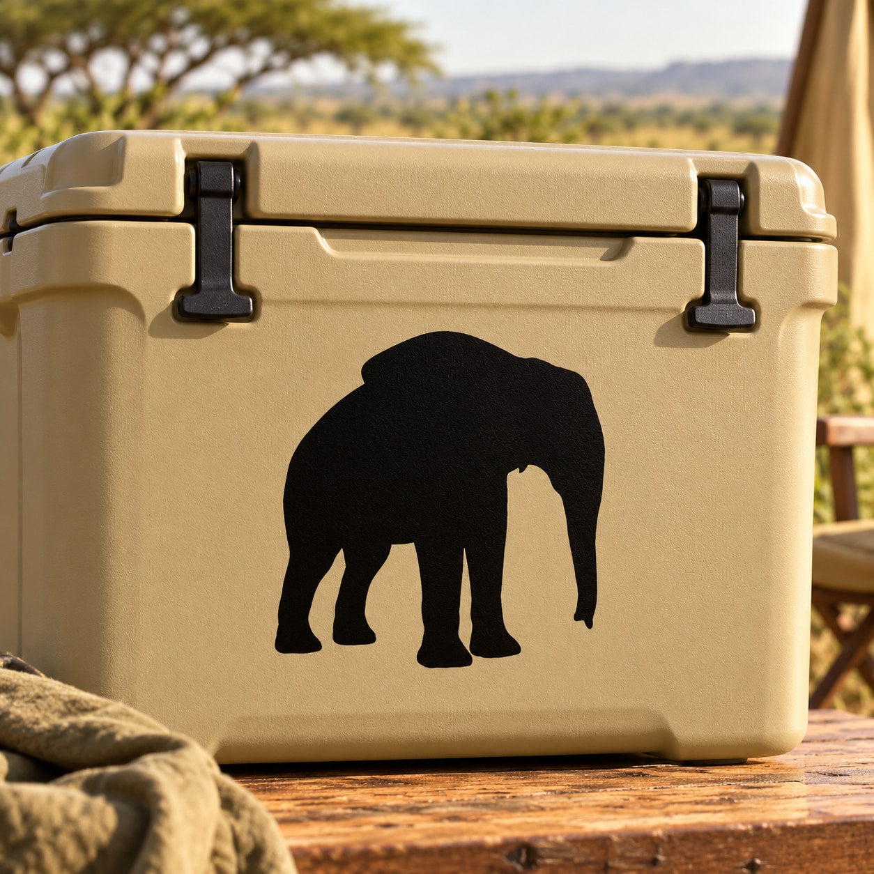 Standing elephant silhouette decal in black on beige surface