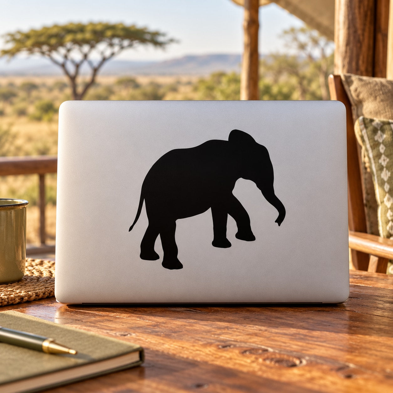 Climbing elephant decal, black silhouette on a light background