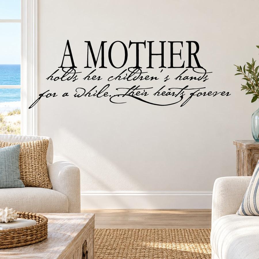 Wall decal with cursive quote: "A MOTHER holds her children’s hands... hearts forever"