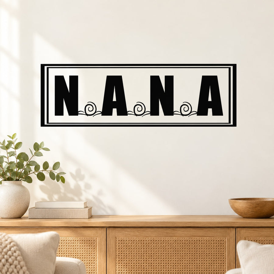 Black-and-white rectangular wall decal with NANA lettering and small circle accents