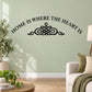 Black wall decal: arched 'HOME IS WHERE THE HEART IS' text with heart knot icon