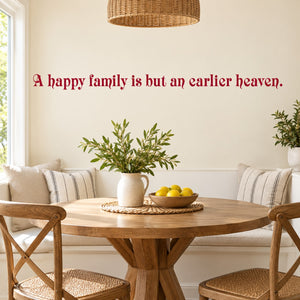 Red cursive wall decal text: 'A happy family is but an earlier heaven.'