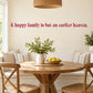 Red cursive wall decal text: 'A happy family is but an earlier heaven.'