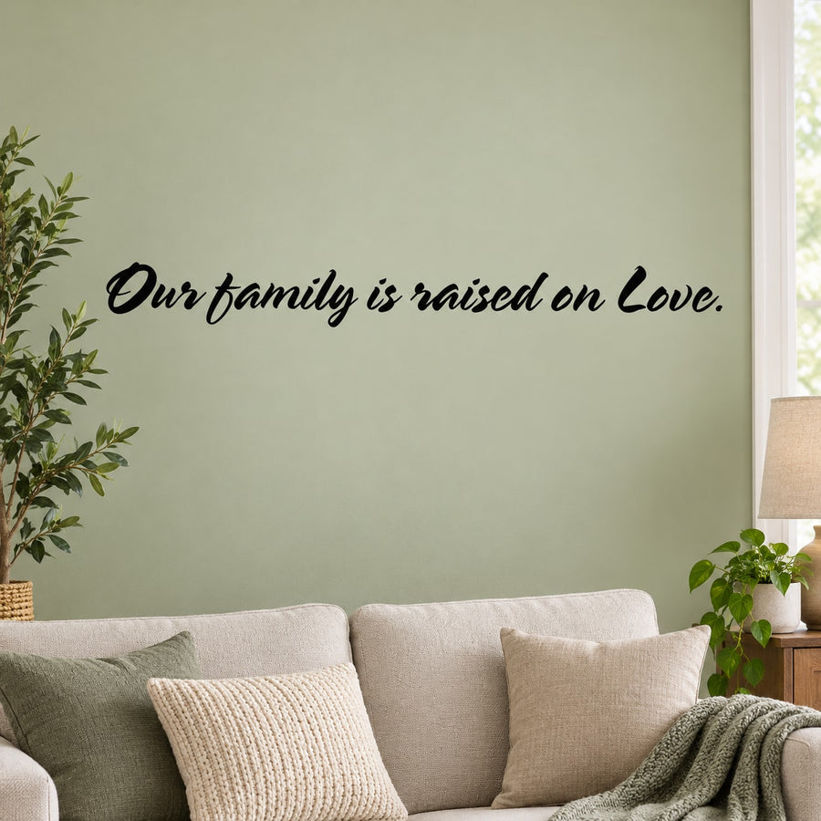 Our family is raised Wall Decal — illustrative vinyl decal application mockup. Surrounding objects are not included.