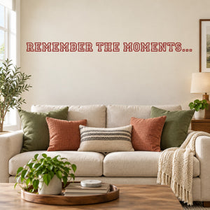 Wall decal with red text: 'REMEMBER THE MOMENTS...'