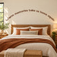 Wall decal with cursive quote: 'Warm memories take us home again'