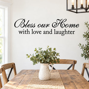 Wall decal with cursive 'Bless our Home with love and laughter' text, black