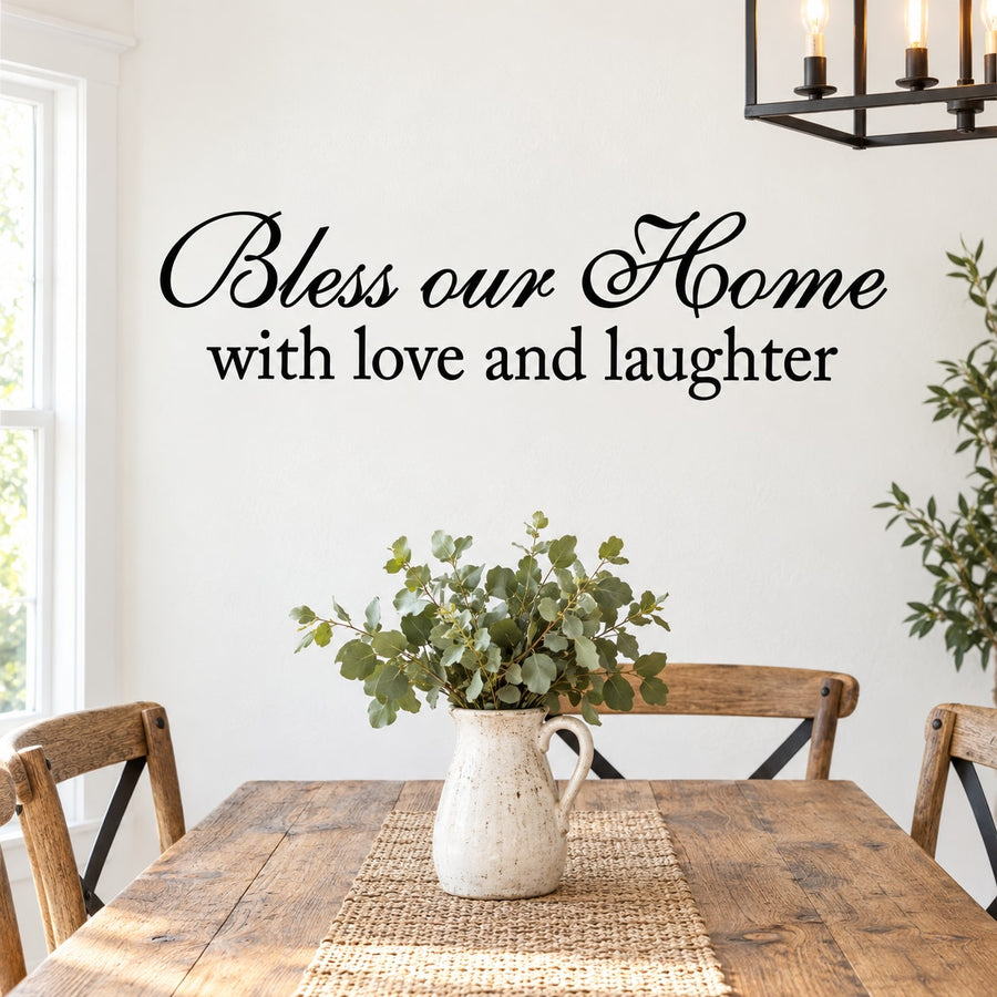 Wall decal with cursive 'Bless our Home with love and laughter' text, black