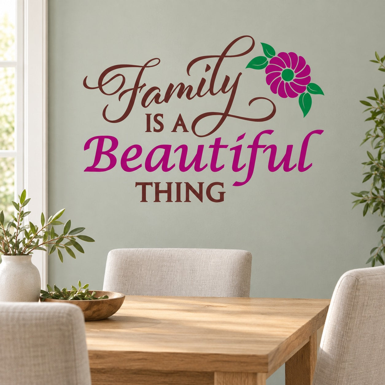 Family wall decal with die-cut script text and pink flower accent, bold purple and brown lettering