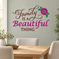 Family wall decal with die-cut script text and pink flower accent, bold purple and brown lettering