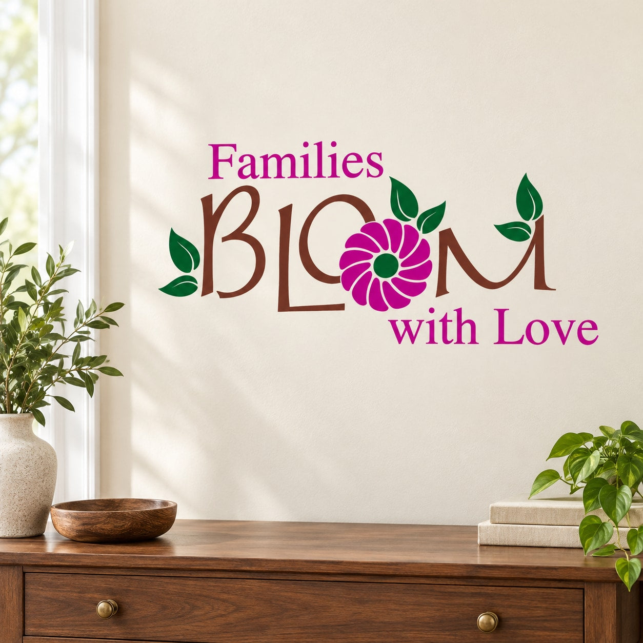 Printed die-cut wall decal with colorful 'Families Bloom with Love' and floral leaves