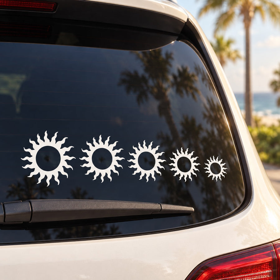 Car rear window decal set with five white sun flare icons
