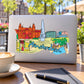 Rectangular Amsterdam sticker with colorful city skyline and handwritten “Amsterdam” text