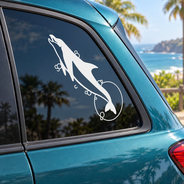 Dolphin and moon window decal with white leaping dolphin on car glass
