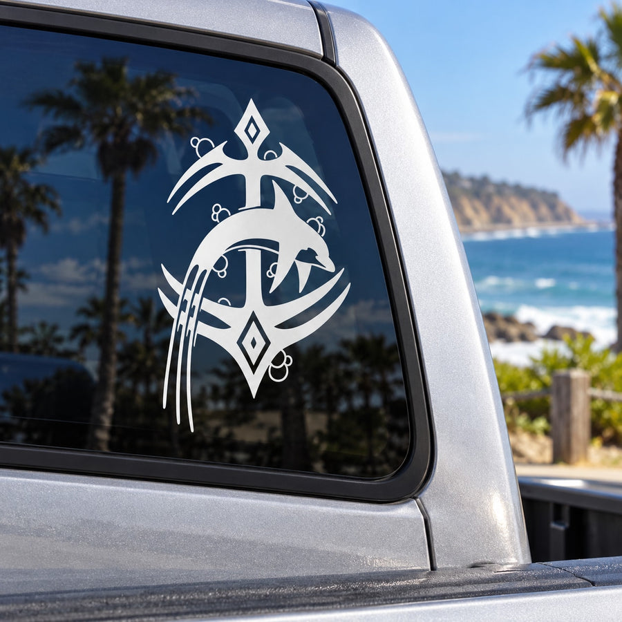 Tribal anchor and dolphin vinyl decal in white on a car window